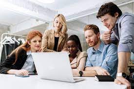 image of students sitting around a table