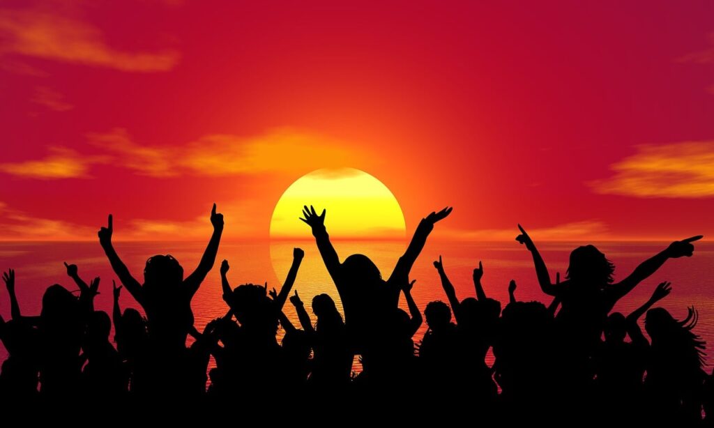 Image of people with their hands waving in the air. Image by Pete Linforth from Pixabay