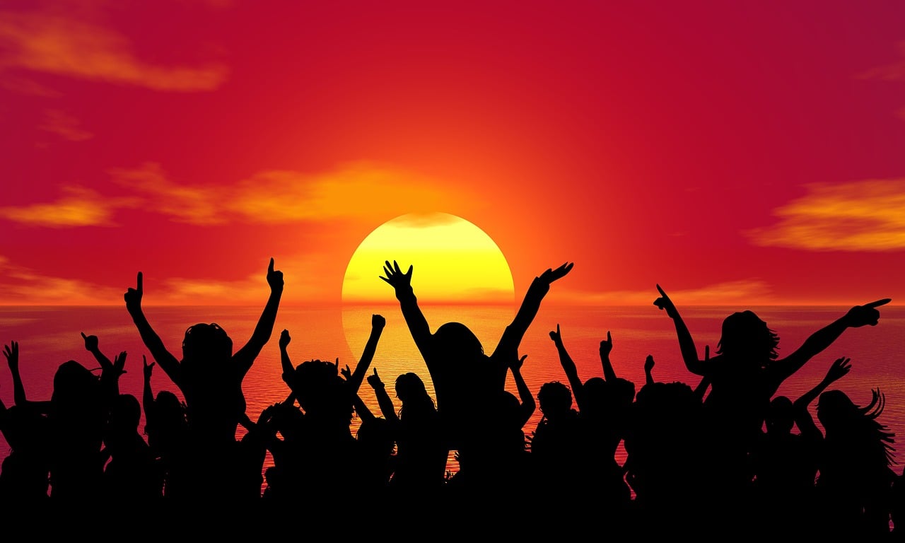 Image of a group of people waving their hands. Image credit: Pixabay.com